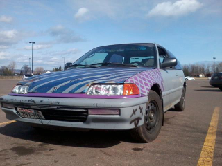 The one only thing I didn’t like about this car was the aftermarket headlights, but I hit a deer in 2011 and could buy a set of fleebay cheapos for half the price of one OEM glass headlight. And yes the turn signal housing is purple.